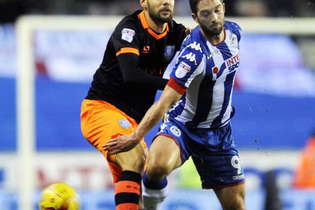 Vincent Sasso gets to grips with Wigan's Will Grigg