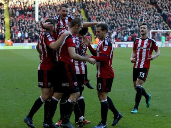 Sheffield United players celebrate James Hanson's first goal for the club