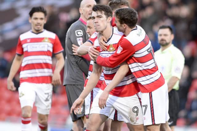 Doncaster Rovers v Morecambe
Sky Bet League Two
Doncaster's John Marquis is congratulated after scoring the equaliser