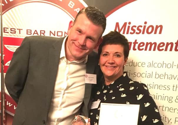 Tracey Ford, from Sheffield City Council's Drug and Alcohol Coordination Team, manages the citys Best Bar None scheme. She has been given the Outstanding Commitment to Best Bar None award. She is pictured with Sheffield Business Improvement District (BID) Police Sergeant Matthew Burdett.