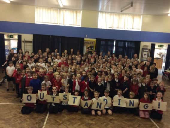 Staff and pupils at Coit Primary, in Chapeltown celebrate their Ofsted report