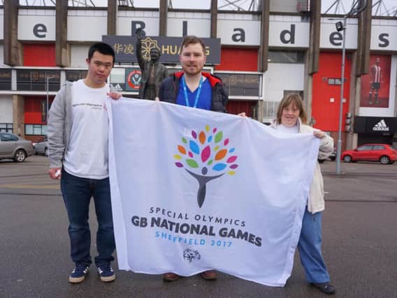 Sheffield dentist Adam Holder, 25, is the 400th person to sign up as a volunteer for the 2017 Special Olympics GB National Games, which will take place in Sheffield in August. He is pictured with city athletes Luke Wan (basketball) and Bethan Morgan (athletics).
