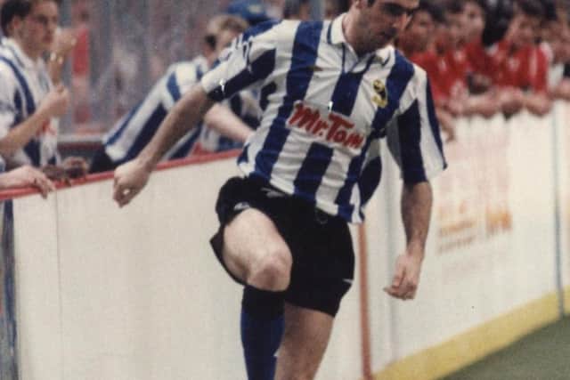 Cantona in the blue and white stripes in January 1992.