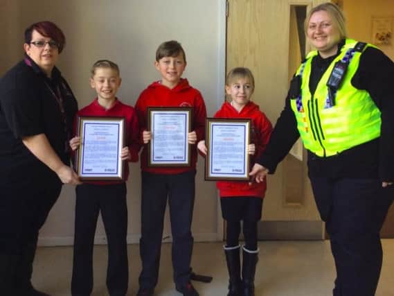 From l to r:- Rebecca Davies, road safety technician for Barnsley Council, Leo Firth, George Sleight, Lauren Firth and PCSO Claire Banks, at Royston Police Station.