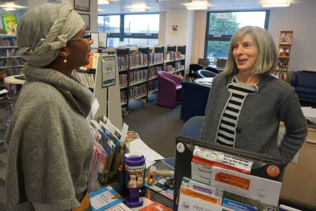 Burngreave Library co-ordinator Marcia Layne talks to volunteer Annie Blindell