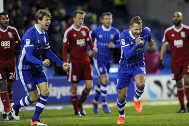 Jordan Rhodes wheels away to celebrate his first goal for Sheffield Wednesday.
