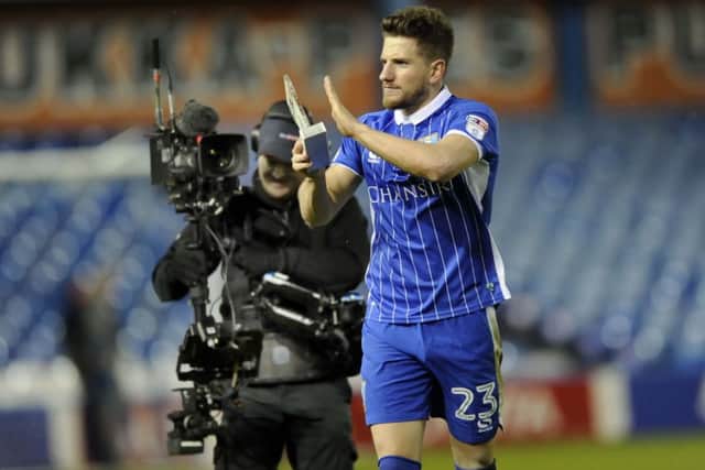 Owls Sam Winnall battles away