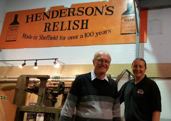 Pat Byrne and Darren Bown with the restored Hendersons Relish sign that's on display at Kelham Island Museum