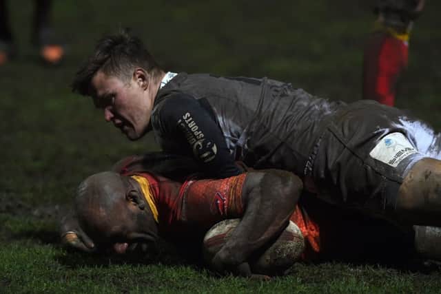 Sheffield Eagles' Menzie Yere scores a try against Toulouse at Wakefield Trinity.