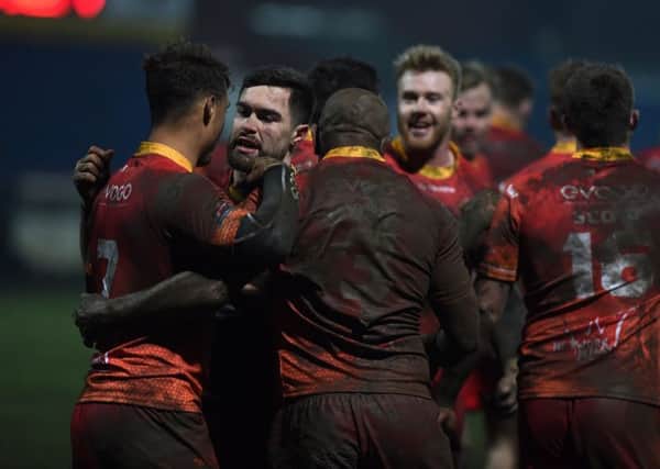 Sheffield Eagles' celebrate Menzie Yere's try against Toulouse at Wakefield Trinity.