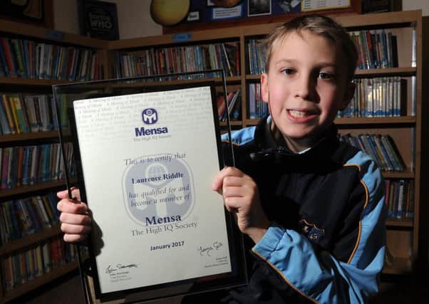 Laurence Riddle with his Mensa certificate