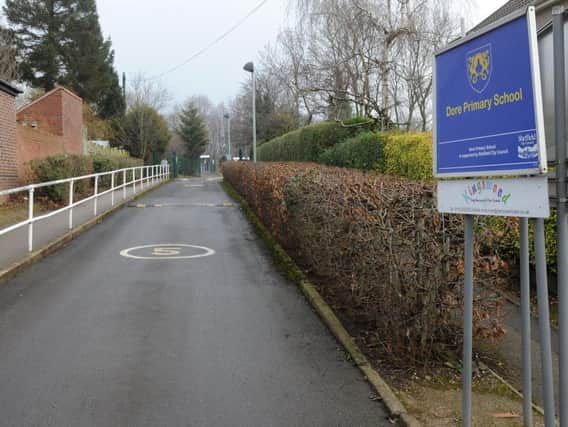 Dore Primary School has banned dogs from the school grounds over health and safety concerns