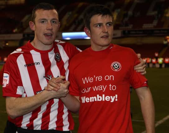 Sheffield United Neil Collins and Harry Maguire celebrate reaching the play-off final