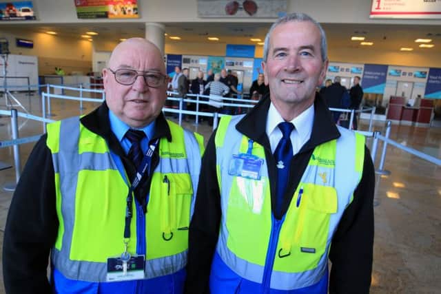 Doncaster Sheffield Airport. Ken Bailey and Paul Maddison from the Friends of Doncaster Sheffield Airport greet passengers as they enter the airport. Picture: Chris Etchells