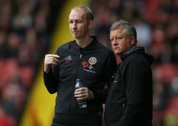Chris Wilder manager of Sheffield Utd and assistant Alan Knill have led United to the top of League One