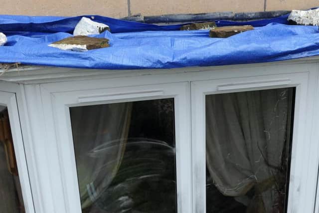 A 'blood-covered' thief tried to steal lead from the window.