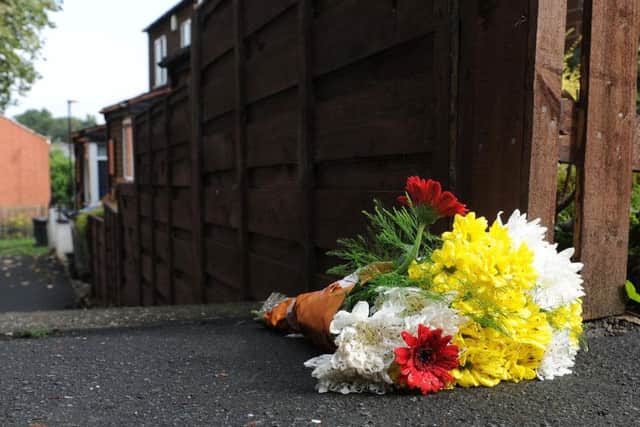 A floral tribute at the scene of the murder