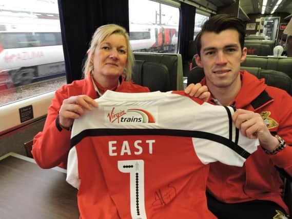 Winning association: Doncaster station deputy team leader Lindsey Hudson united with Rovers' hot shot John Marquis