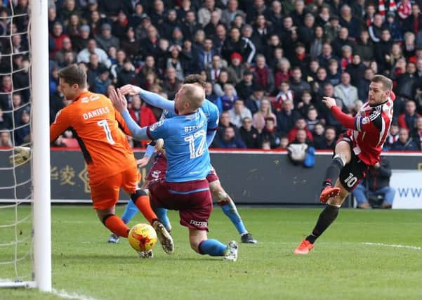 Billy Sharp fires in the equaliser against Scunthorpe. Pic David Klein/Sportimage