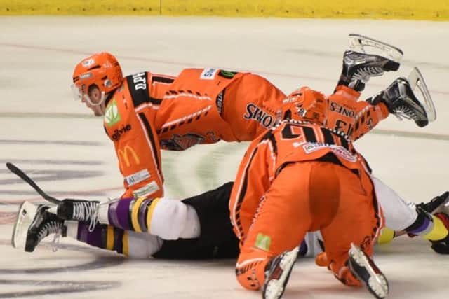 Davey Phillips and John Armstrong battle away for the Steelers