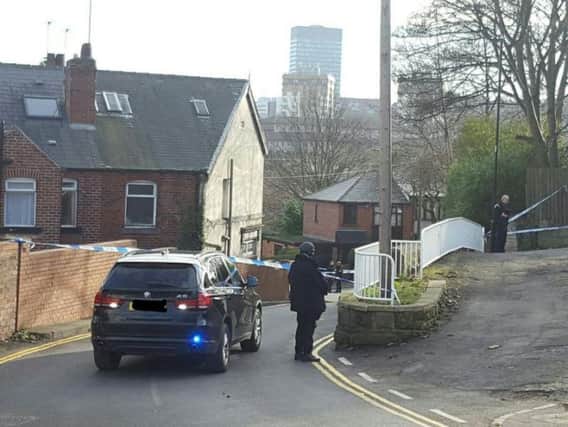 Armed police at the scene of the fatal shooting (PA)