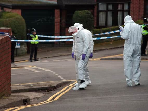 Forensics officers at the scene of the fatal shooting in Upperthorpe