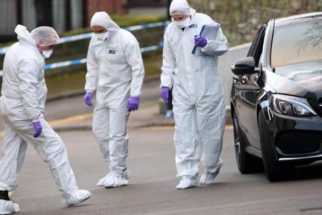 Forensics officers were at the scene of the killing on Saturday afternoon