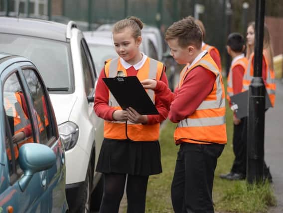 Pupils monitor parking outside Athelstan Primary School (Dean Atkins)