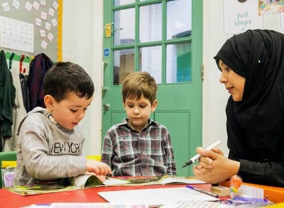 Stock image of youngsters learning through play.