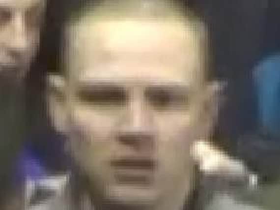 CCTV image of a man wanted in connection with disorder after a football match.
