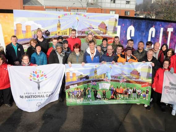 A banner promoting the games is unveiled opposite Sheffield railway station.