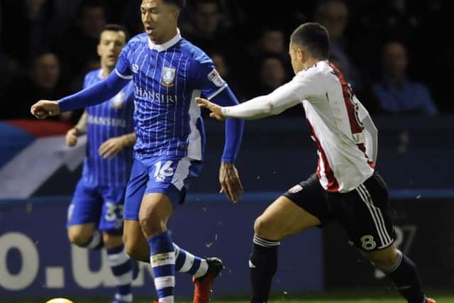 Owls Liam Palmer gets away from Bees Nico Yennaris...Pic Steve Ellis