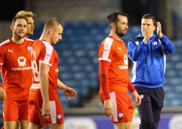 Gary Caldwell and his players applaud the away fans after Spireites draw at Millwall