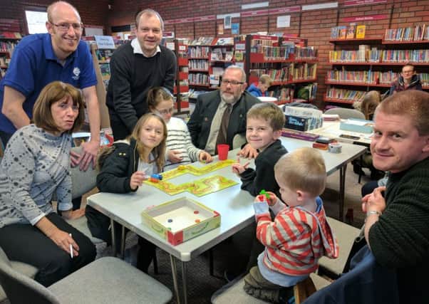 Board games at library guarantees a full house