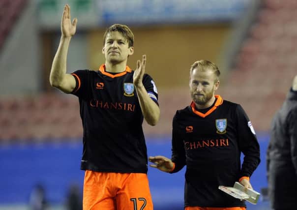 Carlos Carvalhal has expressed the important of Glenn Loovens (left) in the Owls squad