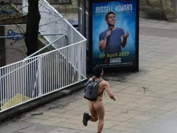 As Storm Doris ,one of the fiercest storms of the winter season, hits the UK a man runs naked through the city centre of Sheffield. Picture Scott Merrylees