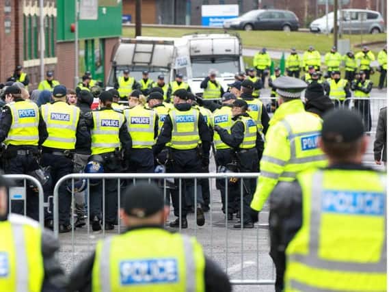 Police at a previous protest in Rotherham