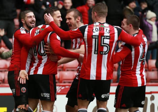 Sheffield United players celebrate Billy Sharp's opening goal against Bolton Wanderers on Saturday