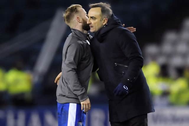 Owls Barry Bannan embraces Carlos Carvalhal at the final whistle after the win over Birmingham....Pic Steve Ellis