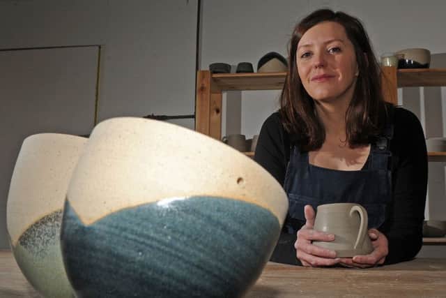 Francesca Hague, of Grey Suit Clay, with piece of her clay work.