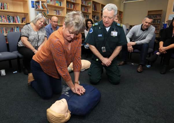 Defibrillator training at Newfield School in Sheffield. Pictured is Gill Robson from the school with Ian Kendall from Yorkshire Ambulance Service.