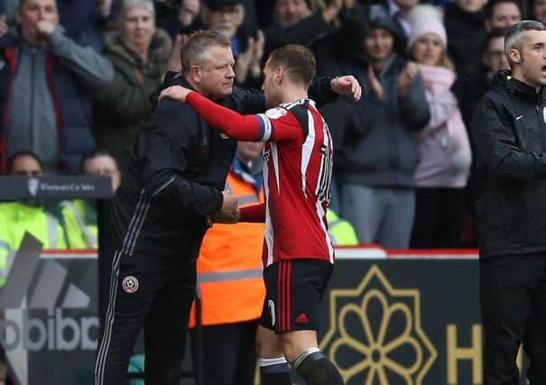 Billy Sharp of Sheffield Utd is hugged by Chris Wilder after scoring twice against Bolton