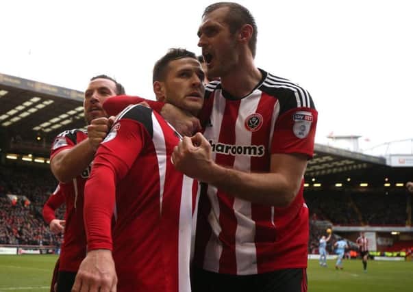 Two-goal Billy Sharp celebrates with Samir Carruthers and James Hanson