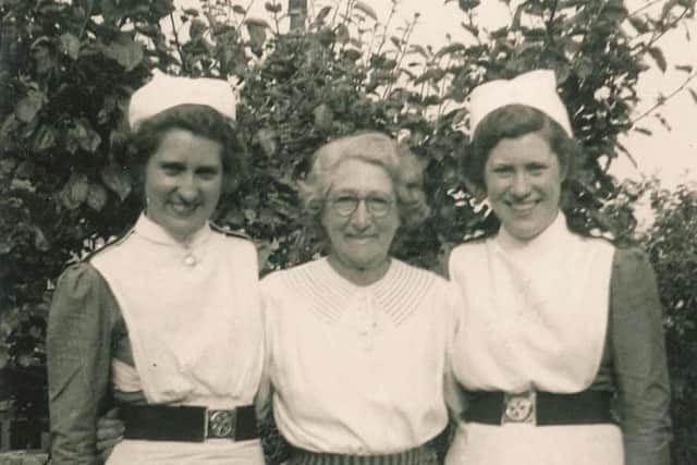 Muriel and Pat in their St John Ambulance uniforms with their mum Amelia