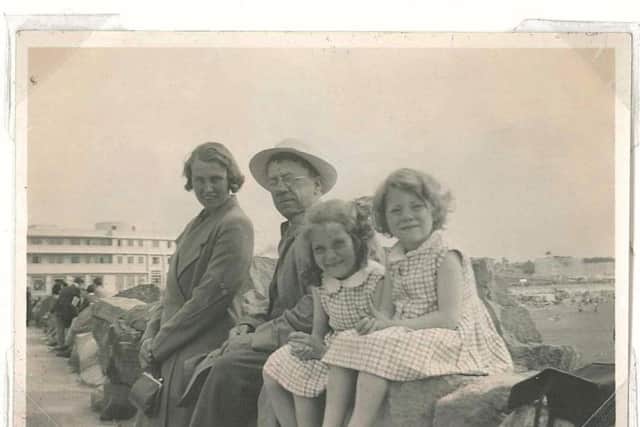 Muriel and Pat at the seaside with their parents, Amelia and Arnold