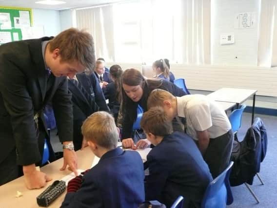 Irwin Mitchell staff helping Chaucer School pupils in 2016