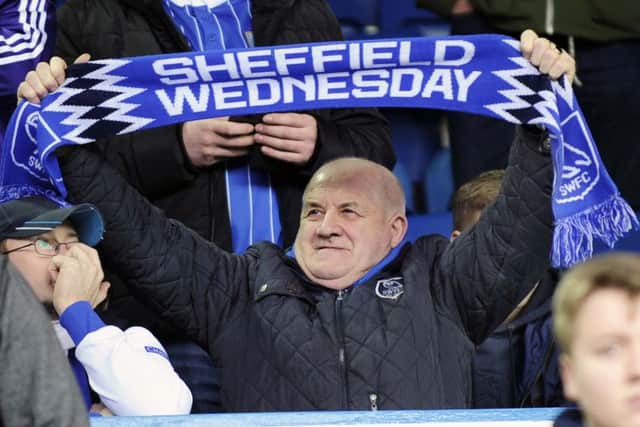 A Sheffield Wednesday fan gets behind the team at Elland Road on Saturday