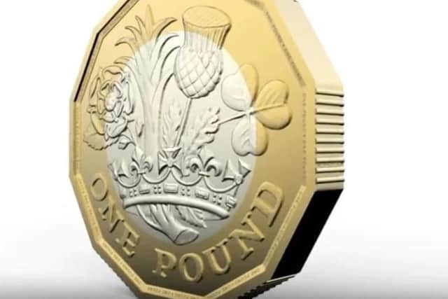 The new eight-sided pound coin.