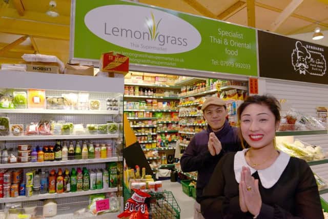 Moor Market Traders for City Buzz Lemongrass Thai Supermarket left Tongchai Prertpornpan and Narumol Dudek