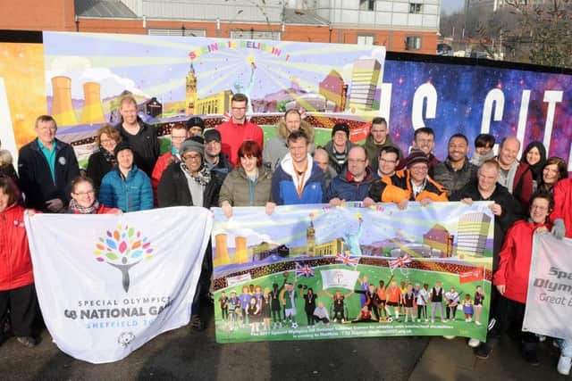 A Special Olympics banner is unveiled opposite the railway station.